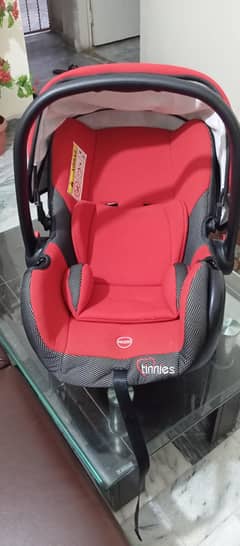tinnies carry cot/car seat