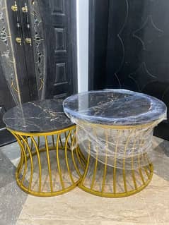 Two brand new round tables- sealed and unopened