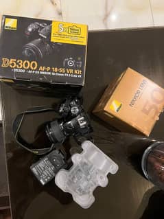 Nikon D5300 with kit lens 18-55mm and 50mm f1.8G prime lens