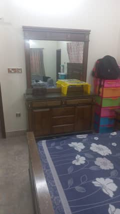 wooden bed and side tables and dressing table without matters