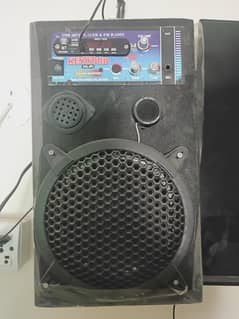 Speaker with  Mic , AUX wire and remote.
