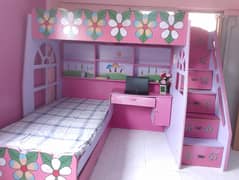 bed with matching side table ,draws , stairs and studying table