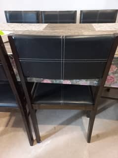 Dinning table with 6 chairs, import quality. 75k demand . price is neg