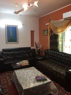 Slightly Used 10-Marla Contemporary Home with Basement, Owner-Tended Interiors, Expansive Lawn, and Secure Street Location Located in Elite DHA Phase 8 Ex Park View with Full Utility Access and Peaceful Surroundings, Offered by Emarat Real Estate.