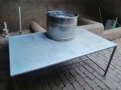 iron table and milk tub