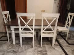 wooden white dining table with chairs