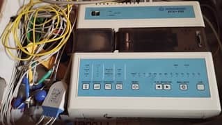 ECG Machine with movable storage trolley and a patient bed