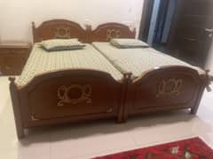 Two single beds along with side tables