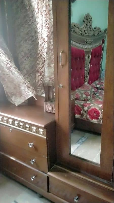 double bed with side tables, dressing and show case 6