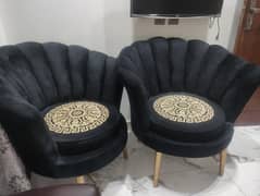two flower chairs and one table for sale.