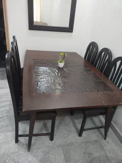 want to sell  wooden dinning table with 6 chairs