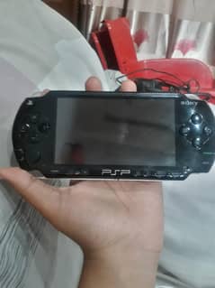 PSP 1004+Charger+2GB Memory Stick+2 CD Games      BATTERY NOT INCLUDED