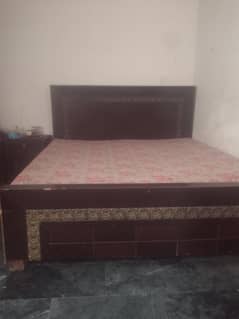 bed with side table
