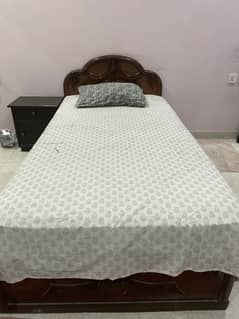 Single bed with spring mattress