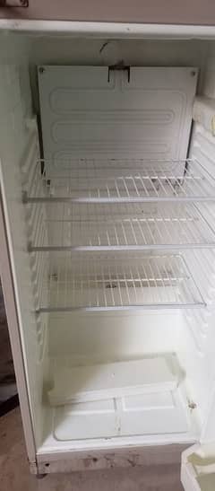 fridge for sale all ok dawlance campany golden in colour