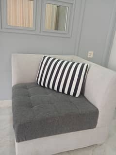Stylish grey one seater sofa