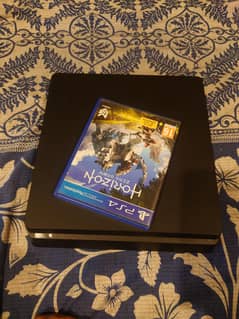 playstation 4 slim with 2 controllers and 1 game