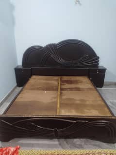 wooden bed without mattress