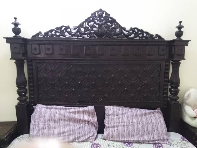 one bed, a dressing table, a side table, and a 3-piece table set. " 2