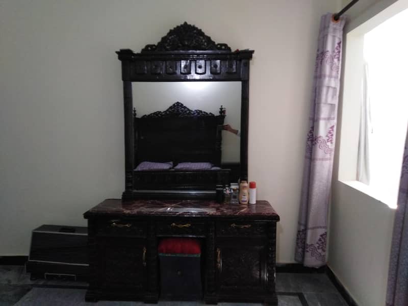 one bed, a dressing table, a side table, and a 3-piece table set. " 7