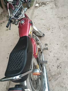 Honda 125 with Golden number