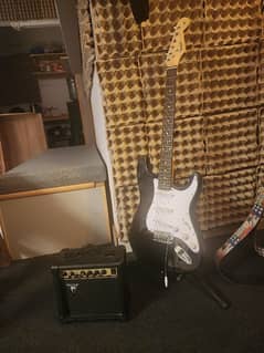fender electric guitar and 10W freeman amp