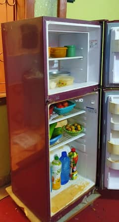 Orient refrigerator glass door medium size red color.