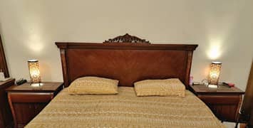 Bed with dresser and side tables