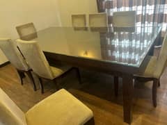 8 seater dinning table in solid wood along with 8 chairs