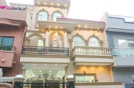 5 Marla Brand New House Near Emporium Mall Solid Construction Gated Area Near Park Market And Mosque