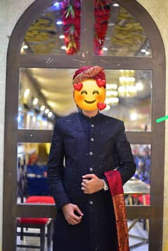 Groom sherwani with handwork.