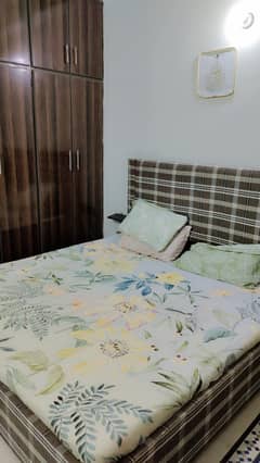 king size bed with mattress and dressing.
