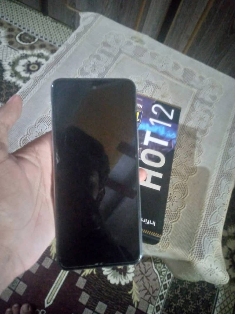 Infinix hot 12 with box slightly used. 10/10 condition 1