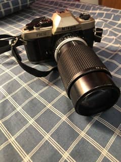 Nikon Film Camera with Nikon Lens