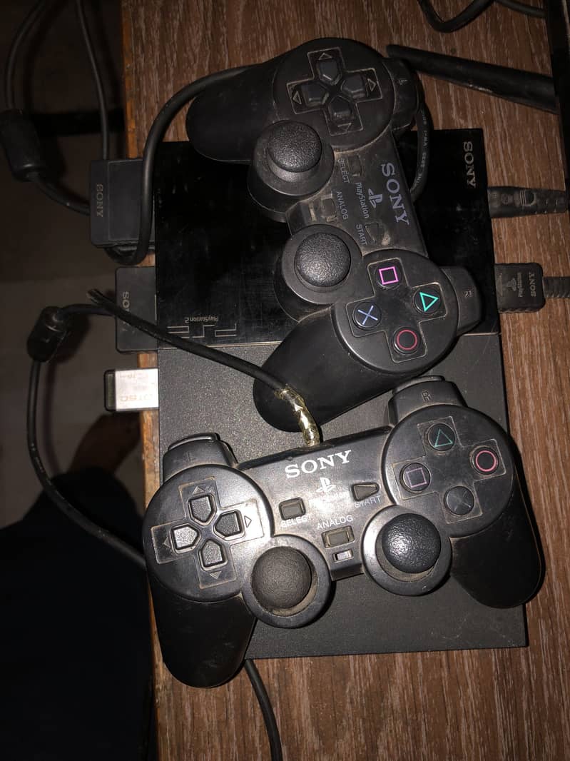ps 2 with 2 controllers ,memory card and usb with 4 games 3