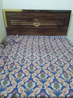 king size wooden bed and cupboard