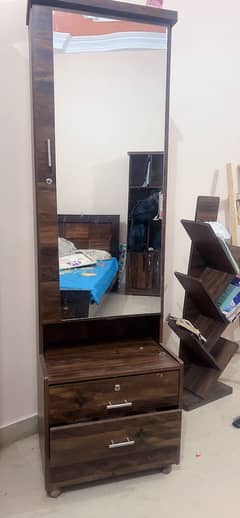 wardrobe and 2 single beds dresser with shelves behind mirror