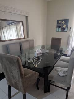 Slightly used dining table with 8 chairs good condition