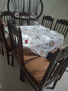 Dinning table with 8 chairs in used condition