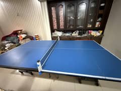 Blue tennis table with net