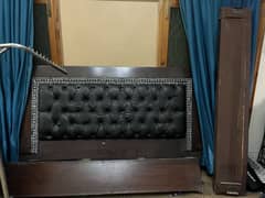 King sized wooden bed