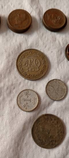 1 paisa and other Pakistani coin