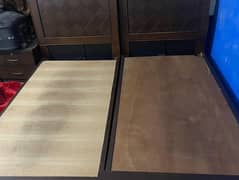 2 single beds up for sale with side table without mattress