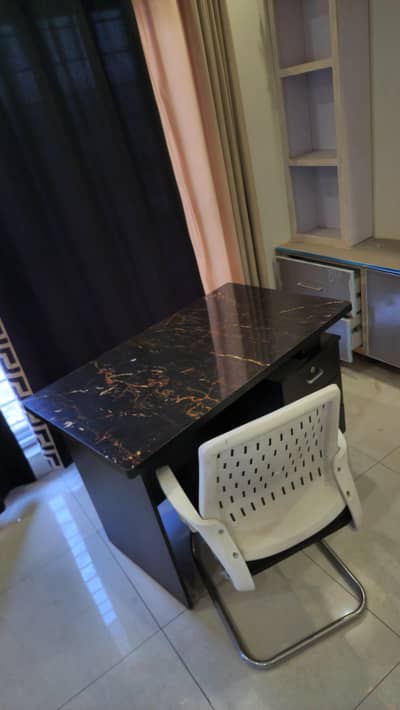 Study table with cushioned chair