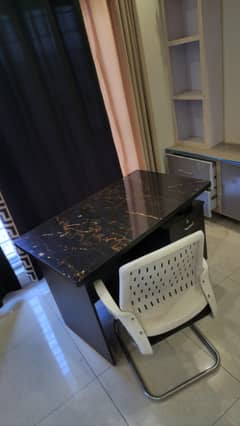 study table with cushioned chair