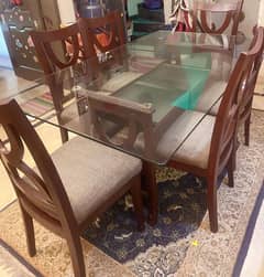 Glass top wooden dinning table