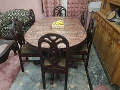 six seater wooden dining table with  chairs