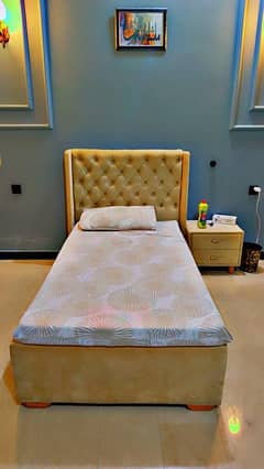 Single bed with side table