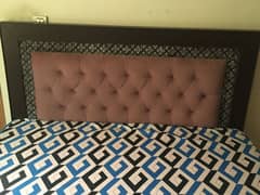 Queen bed with 2 side tables and a mattress