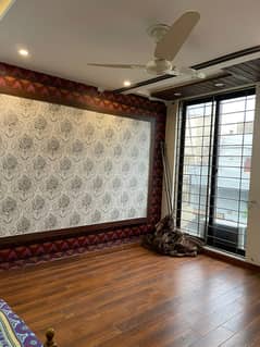 10 Marla Tile Floor House is For rent in wapda town Block F2.